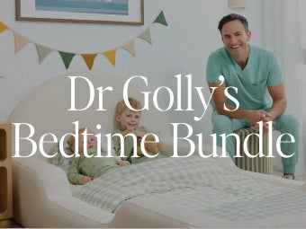 A man in teal medical scrubs sits beside a bed with a child in a softly lit bedroom. Large overlaid text reads 'Dr Golly's Bedtime Bundle.